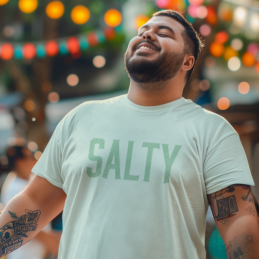 Salty T-shirt on a man smiling and looking up at the sky